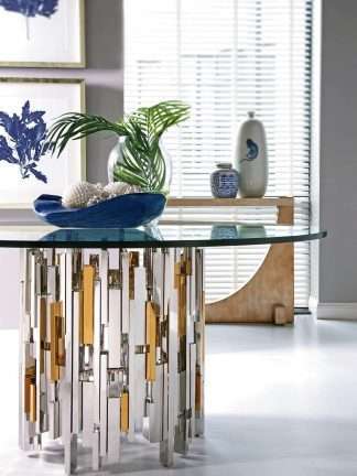 modern dining table with metal base and glass top